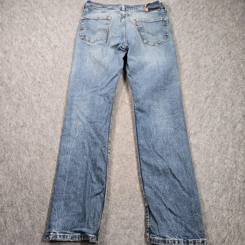 Levis Jeans Mens 34x32 (tag 34x34) Blue Wash Relaxed Straight Distressed Denim